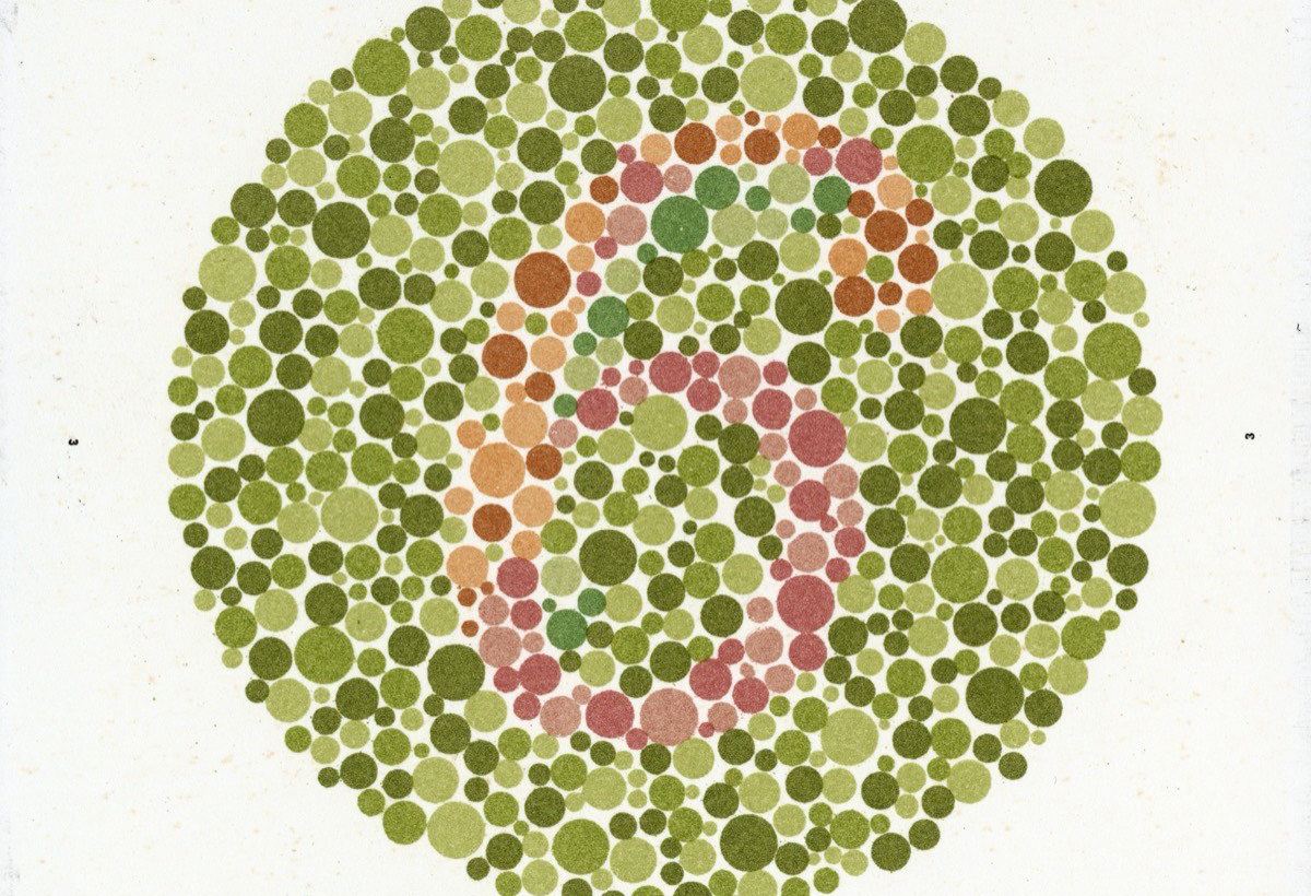 A colour vision test plate with a number hidden in coloured dots